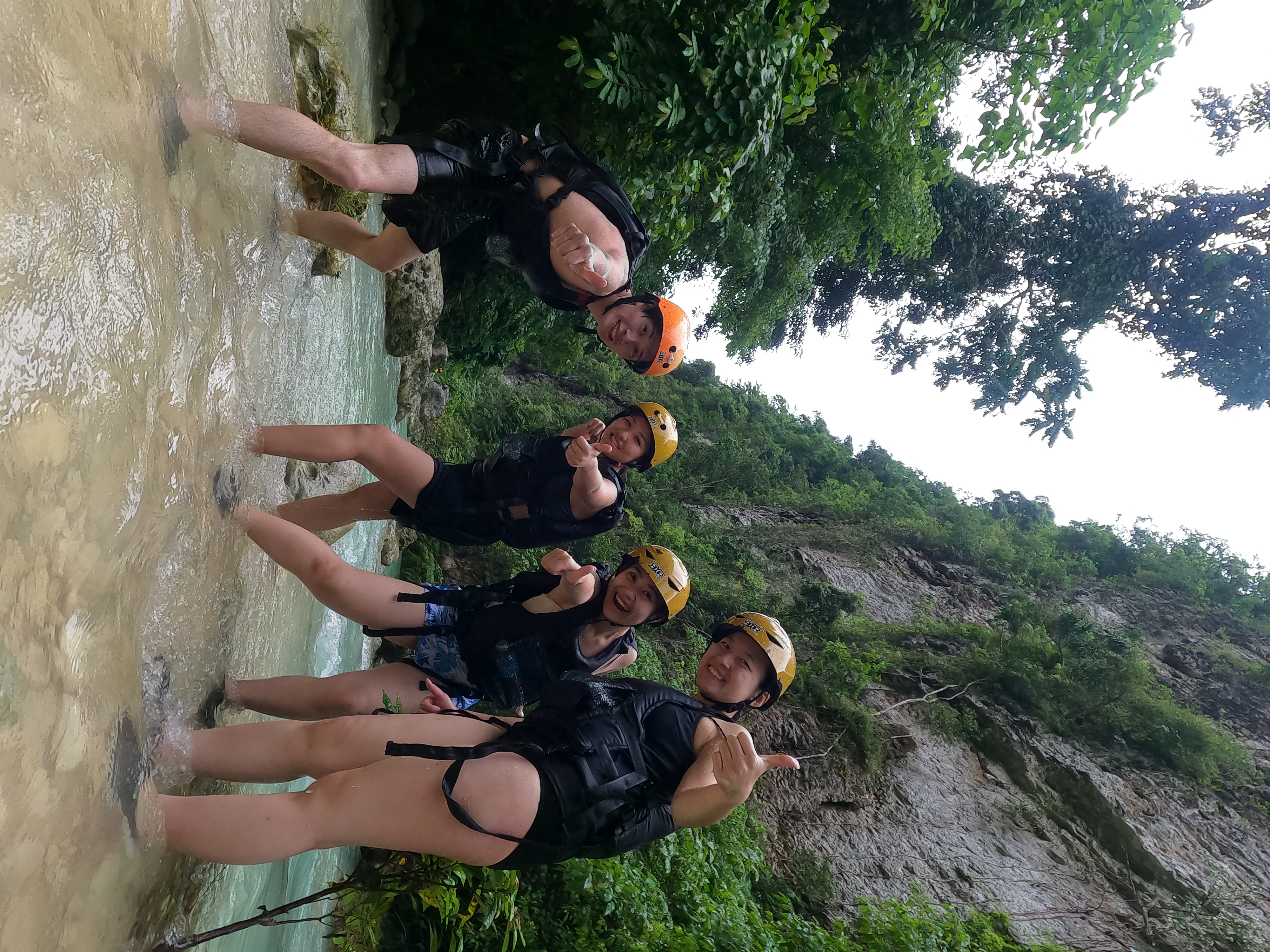 Guest photo — group in wetsuits and helmets at Kawasan canyon, Cebu