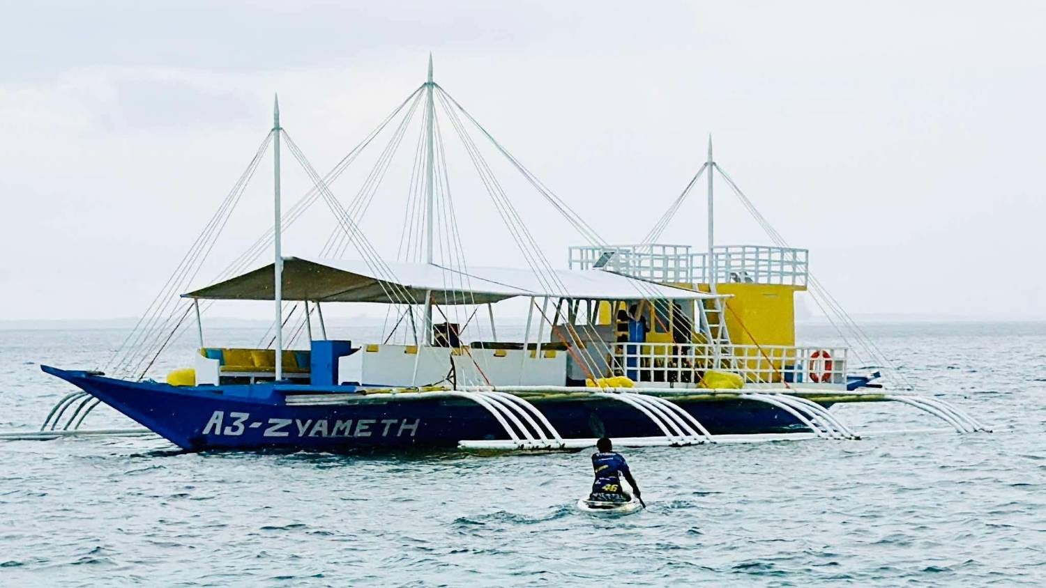 Cebu OK Travel outrigger boat underway on an island hopping tour