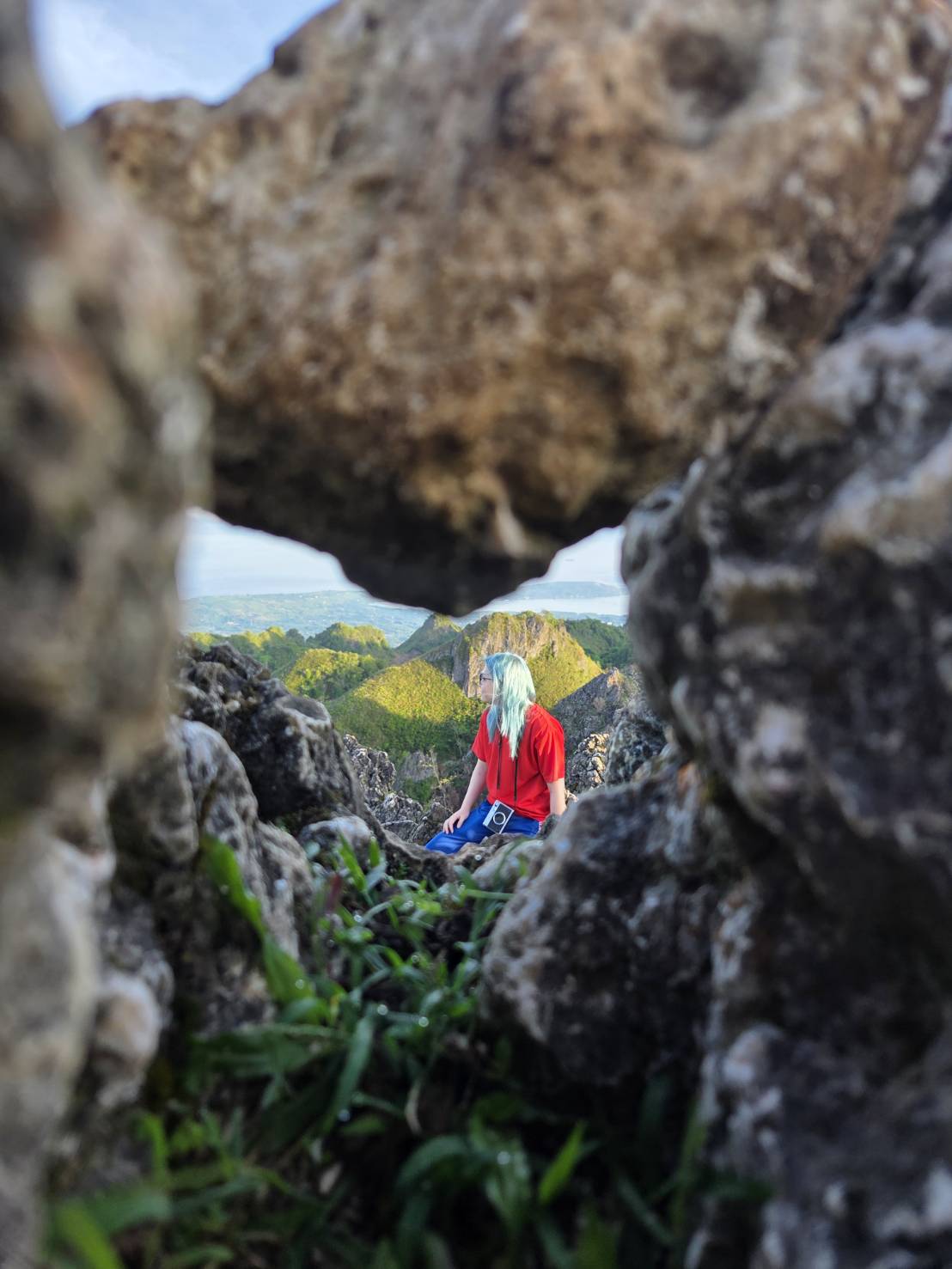 Guest photo — photographer at natural rock window, Osmeña Peak Cebu
